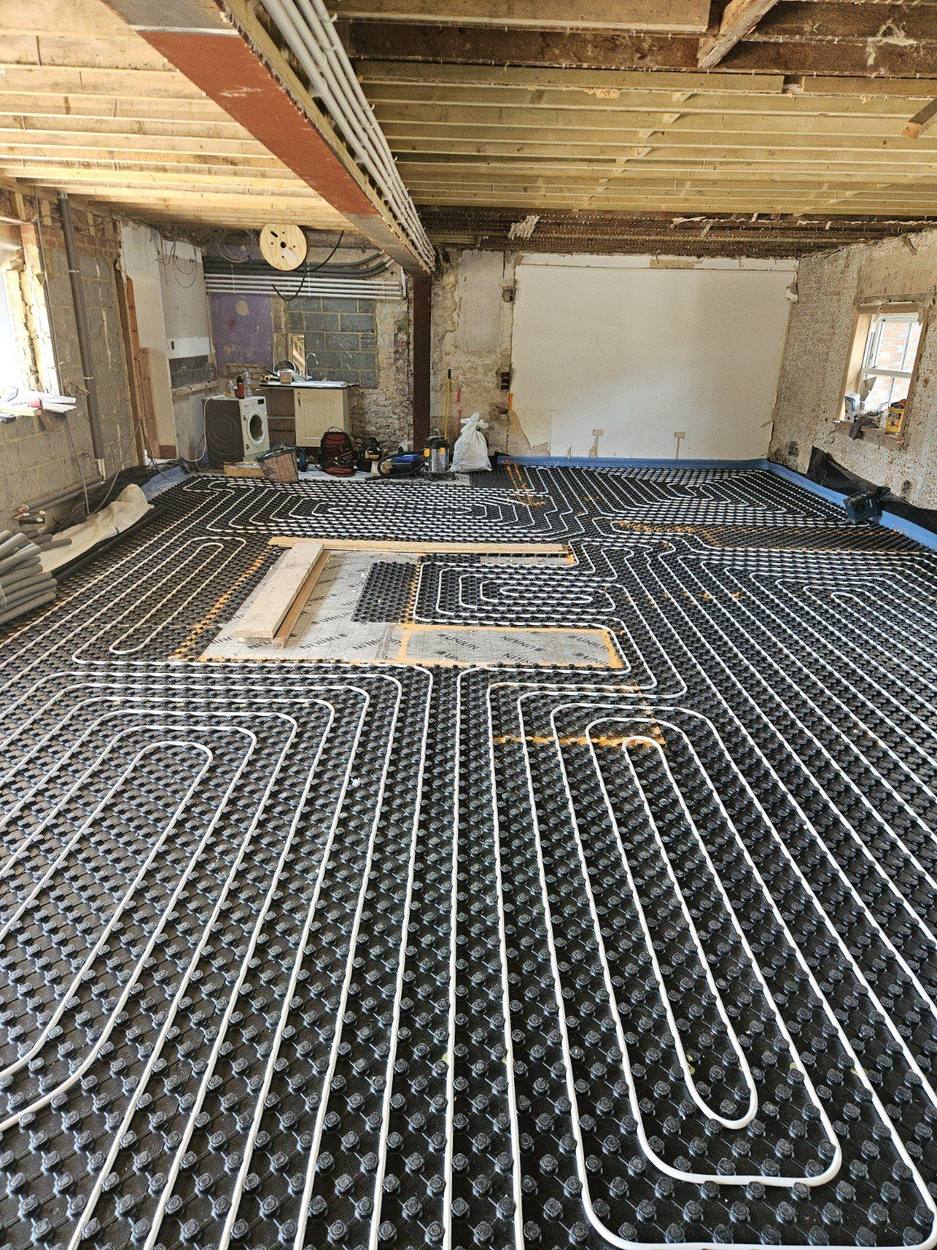Underfloor heating installation across an open-plan area